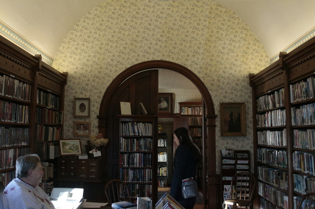 Grand library interior with arched shelves