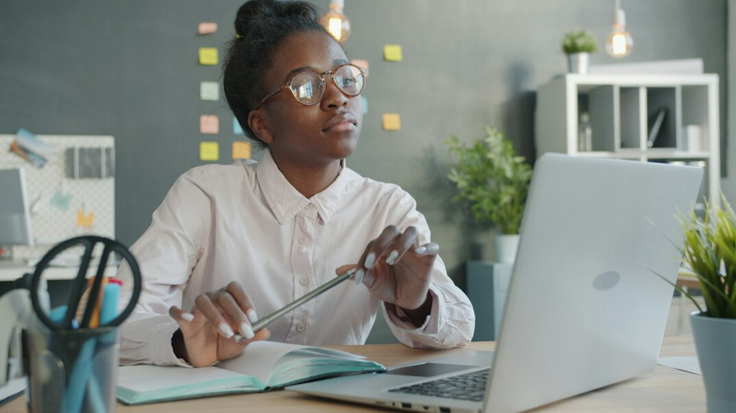 woman thinking with notebook